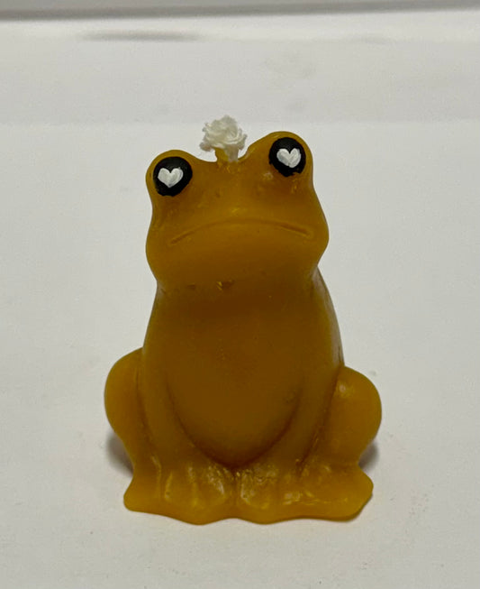 Beeswax candle. Frog